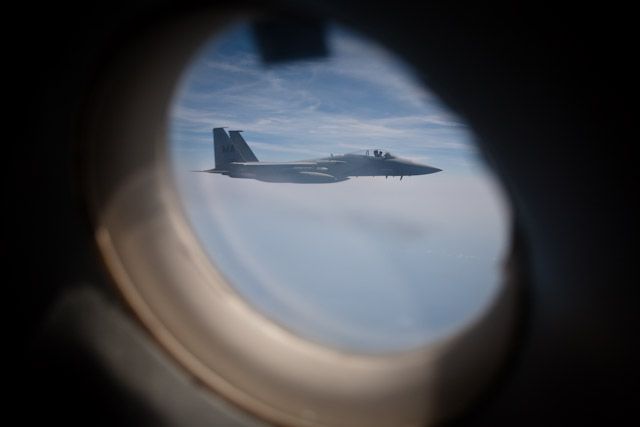 Through the door window, a F-15 hangs out for a photo-op.